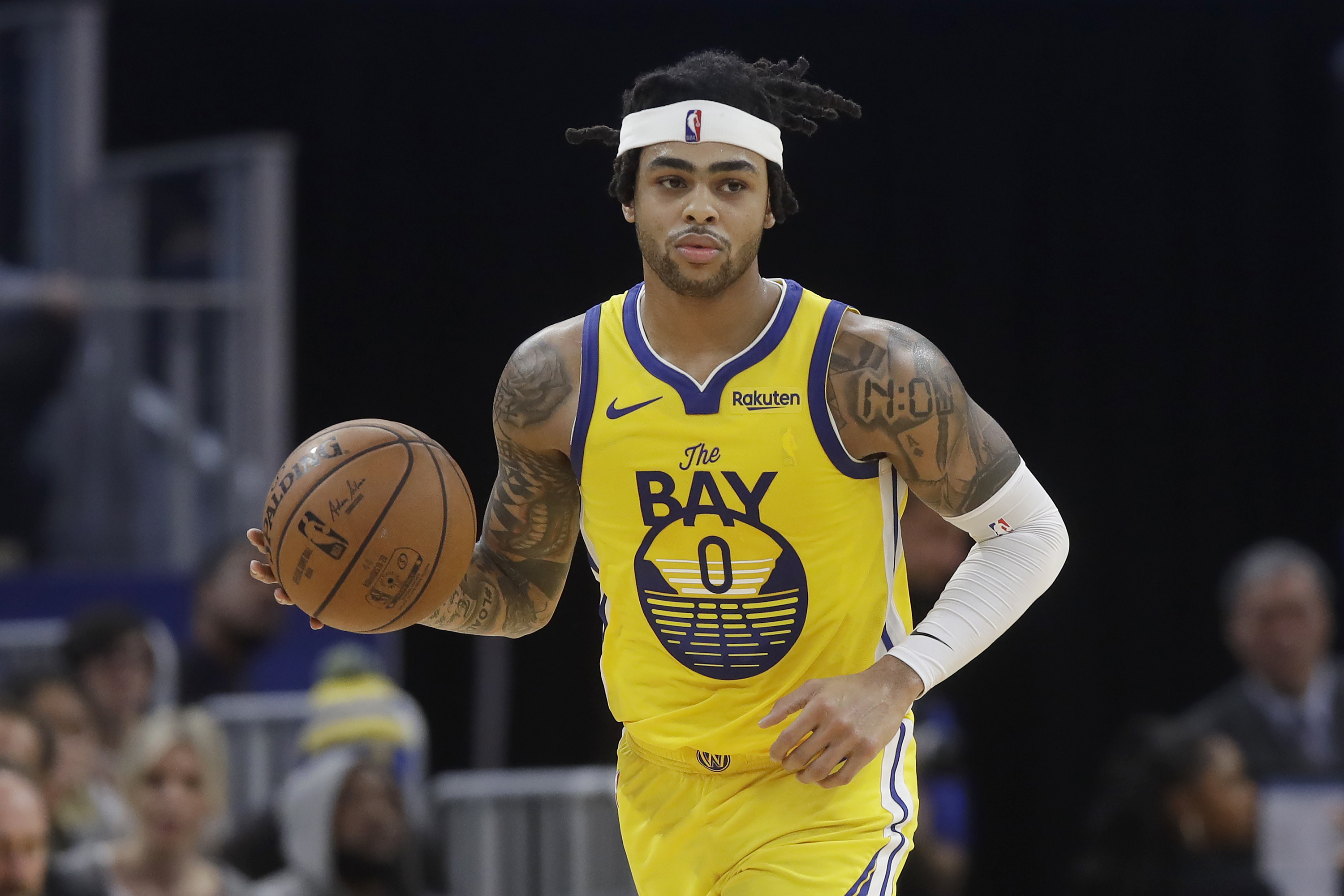 Golden State Warriors guard D'Angelo Russell (0) dribbles upcourt against the Dallas Mavericks during the second half of an NBA basketball game in San Francisco, Saturday, Dec. 28, 2019. (AP Photo/Jeff Chiu)